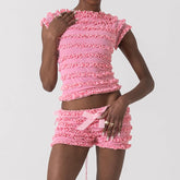 Person wearing a pink ruffled outfit